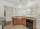 Efficient kitchen with dark appliances, wooden cabinetry, and an open view to the living area at 5306 Prosperity View Dr, Charlotte, NC 28269