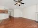 Open-concept living area showcasing hardwood floors and seamless transition to the kitchen at 5306 Prosperity View Dr, Charlotte, NC 28269