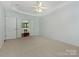 Spacious main bedroom showing ensuite access with double doors and neutral decor at 5306 Prosperity View Dr, Charlotte, NC 28269
