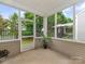 Relaxing screened porch offers views of the backyard at 5306 Prosperity View Dr, Charlotte, NC 28269