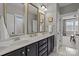Elegant bathroom with double sinks, decorative mirrors, and dark cabinetry for ample storage at 536 Spring Landing Dr, Rock Hill, SC 29730