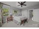 Charming bedroom featuring a large window, ceiling fan and a cozy bed with decorative pillows at 536 Spring Landing Dr, Rock Hill, SC 29730