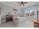 Cozy bedroom with a ceiling fan, plush carpet, and natural light from the large window at 536 Spring Landing Dr, Rock Hill, SC 29730