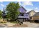 Inviting two-story purple home with a balcony overlooking the front yard and a convenient drive-under garage at 536 Spring Landing Dr, Rock Hill, SC 29730
