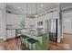 Well-equipped kitchen with stainless steel appliances, island with seating, white cabinets and granite countertops at 536 Spring Landing Dr, Rock Hill, SC 29730