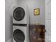 Modern laundry room featuring stacked washer and dryer units at 536 Spring Landing Dr, Rock Hill, SC 29730