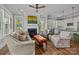 Open-concept living room with hardwood floors, a fireplace, white cabinets and a green island at 536 Spring Landing Dr, Rock Hill, SC 29730