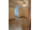 Cozy bedroom features neutral carpeting and paint, a ceiling fan with light, and a charming attic ceiling at 550 Camrose Ne Cir, Concord, NC 28025