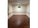 Bright dining room featuring wood-look laminate flooring and a hanging chandelier at 550 Camrose Ne Cir, Concord, NC 28025