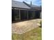 The patio has a brick floor, an awning, and sliding glass doors leading into the home at 550 Camrose Ne Cir, Concord, NC 28025