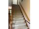 Carpeted staircase with wooden handrails at 550 Camrose Ne Cir, Concord, NC 28025