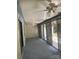 Bright sunroom with blue carpet, white walls, wood paneling, ceiling fans and sliding glass doors to the backyard at 550 Camrose Ne Cir, Concord, NC 28025