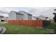 Wood privacy fence surrounding a backyard with green grass at 585 Gentle Breeze Ln, Rock Hill, SC 29730