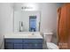 Bathroom featuring a vanity with a large mirror and white sink at 585 Gentle Breeze Ln, Rock Hill, SC 29730