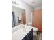 Bright bathroom featuring a large mirror, updated fixtures, and a shower-tub combo at 585 Gentle Breeze Ln, Rock Hill, SC 29730