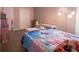 Spacious bedroom with a colorful comforter, a modern lamp, and multiple storage options at 585 Gentle Breeze Ln, Rock Hill, SC 29730