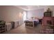 Bright bedroom featuring a modern desk, charming decor, and ample natural light from a window at 585 Gentle Breeze Ln, Rock Hill, SC 29730