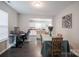 Dining area open to the kitchen with modern decor and ample natural light at 585 Gentle Breeze Ln, Rock Hill, SC 29730