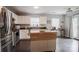 Bright kitchen featuring stainless steel appliances, white cabinets, and a convenient rolling island at 585 Gentle Breeze Ln, Rock Hill, SC 29730