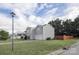 Street view of a two-story house with light gray siding, a garage and a lawn at 585 Gentle Breeze Ln, Rock Hill, SC 29730