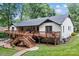 Backyard featuring a large deck and wooden walkway at 625 S Magnolia St, Mooresville, NC 28115