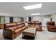 Basement with a large brown leather sofa at 625 S Magnolia St, Mooresville, NC 28115