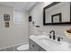 Bathroom featuring a marble countertop and patterned floor at 625 S Magnolia St, Mooresville, NC 28115