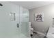 Modern bathroom features a glass-enclosed shower with white tiling, an art niche, and stylish fixtures at 625 S Magnolia St, Mooresville, NC 28115