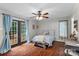 Charming bedroom featuring a comfortable bed, natural light, and double doors leading to the outdoor deck at 625 S Magnolia St, Mooresville, NC 28115