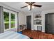Bedroom with a large window and hardwood flooring at 625 S Magnolia St, Mooresville, NC 28115