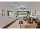 Comfortable living room with hardwood floors, neutral furniture, and built-in shelves at 625 S Magnolia St, Mooresville, NC 28115