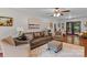 Cozy living room with hardwood floors, neutral furniture, and access to the deck at 625 S Magnolia St, Mooresville, NC 28115