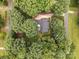 An aerial view showcases a home surrounded by mature trees, offering privacy and natural beauty at 635 Timberlane Trl, Salisbury, NC 28147