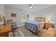 Cozy bedroom featuring a wooden bed frame, a ceiling fan, and a bright window with natural light at 635 Timberlane Trl, Salisbury, NC 28147
