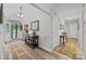 Welcoming foyer featuring hardwood floors, a console table, and a bright open doorway at 635 Timberlane Trl, Salisbury, NC 28147