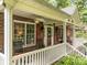 Inviting front porch with rocking chairs offering a relaxing outdoor living space at 635 Timberlane Trl, Salisbury, NC 28147