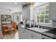 Bright kitchen featuring a large window, gray cabinets, and stainless steel appliances at 635 Timberlane Trl, Salisbury, NC 28147