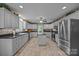 Open kitchen featuring a center island, stainless steel appliances, and tile floors at 635 Timberlane Trl, Salisbury, NC 28147