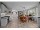 Bright kitchen area with dining table, tile floors, and windows providing natural light at 635 Timberlane Trl, Salisbury, NC 28147