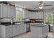 Modern kitchen featuring black countertops, tile backsplash, and stainless steel appliances at 635 Timberlane Trl, Salisbury, NC 28147