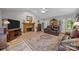 Inviting living room with hardwood floors, a brick fireplace, and comfortable leather seating at 635 Timberlane Trl, Salisbury, NC 28147