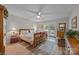 Sunlit main bedroom featuring a bed, access to the balcony, and hardwood floors at 635 Timberlane Trl, Salisbury, NC 28147
