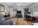 Comfortable home office setup with desk, chair, television, and natural light at 635 Timberlane Trl, Salisbury, NC 28147