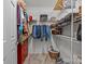 Efficient walk-in closet with built-in shelving and ample storage space for clothes and accessories at 635 Timberlane Trl, Salisbury, NC 28147