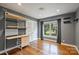 Functional bedroom with sleek desk setup, closet space, and natural light at 7050 Knightswood Dr, Charlotte, NC 28226