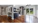 Open-concept kitchen boasts stainless steel appliances, granite countertops, and a seamless connection to the outdoor space at 7050 Knightswood Dr, Charlotte, NC 28226