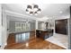Stylish kitchen with built-in cabinets and granite island cooktop, perfect for gatherings with adjoining living room at 7050 Knightswood Dr, Charlotte, NC 28226