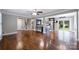 Spacious living room featuring hardwood floors, open layout to the kitchen, and plenty of natural light at 7050 Knightswood Dr, Charlotte, NC 28226