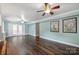 Open living area with hardwood floors, French doors, and neutral paint at 7050 Knightswood Dr, Charlotte, NC 28226
