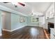 Light-filled living room with hardwood floors, fireplace, and neutral paint at 7050 Knightswood Dr, Charlotte, NC 28226